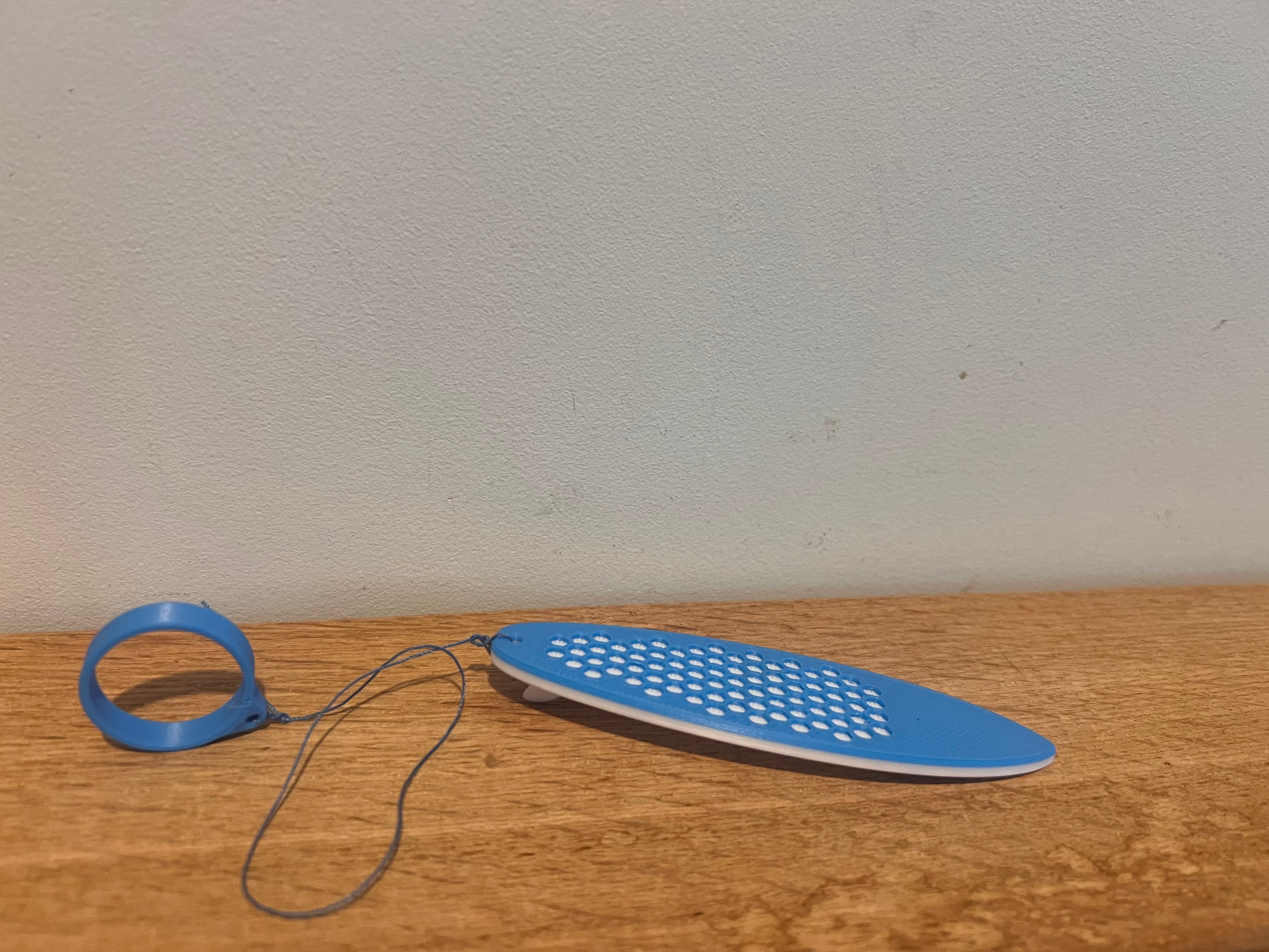 Cool Mini Wind Surf Board - Complete with a built-in finger loop for easy grip and control.