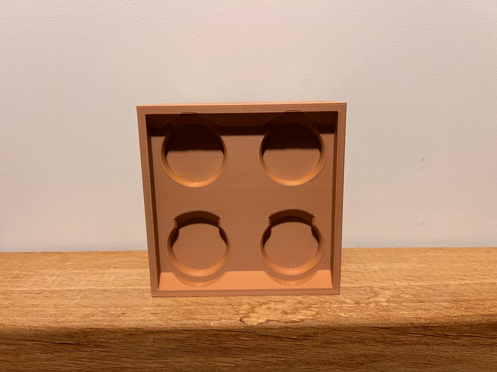 Lego-inspired 3D-printed 2×2 brick featuring a smooth sliding drawer.