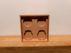 Lego-inspired 3D-printed 2×2 brick featuring a smooth sliding drawer.
